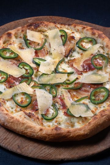 Pizza Bianco with honey cured bacon, rosemary and jalapeño peppers