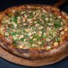 Pizza Gorgonzola, toasted hazelnuts and parslay